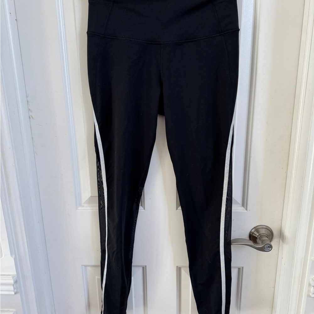Victoria secret sport leggings. Black with sparkle silver side stripe. Medium.